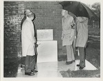 President Chambers and others, in the rain, May 4, 1975, Dedication Ceremony